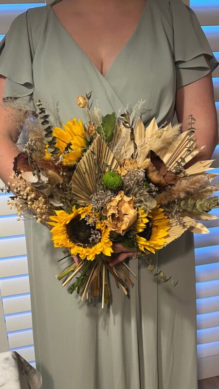 Bouquet of sunflowers, dried palms and pampas grass