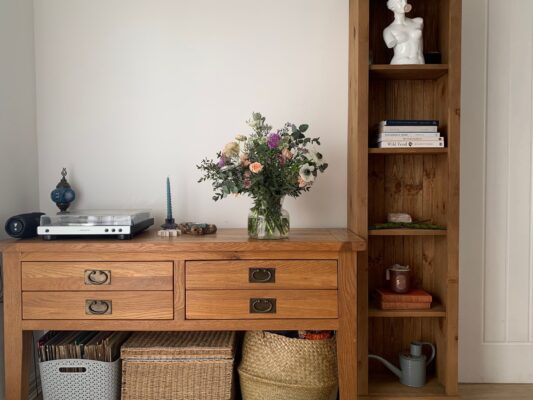 Flower Club Delivery - a bouquet on the side in a home.