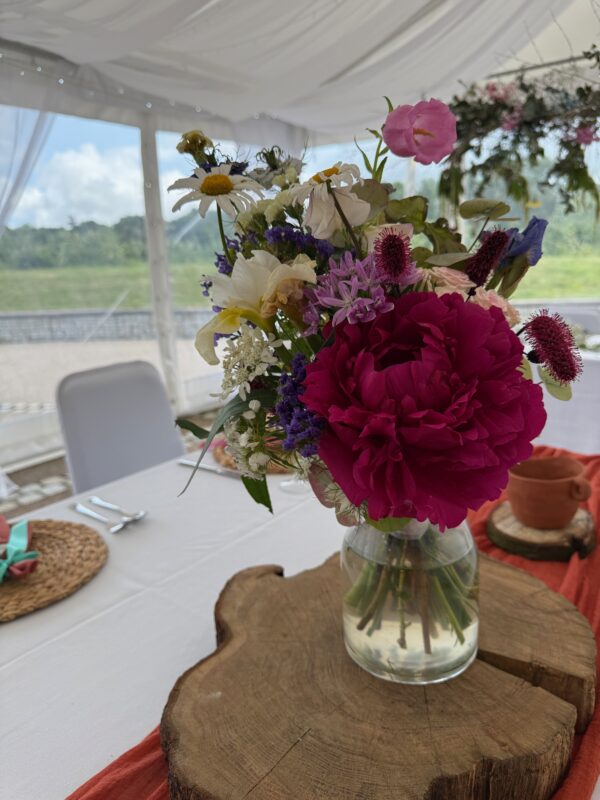 Bridesmaid Bouquets reused as centrepieces by Blooming Roza at Hoad Farm Barn