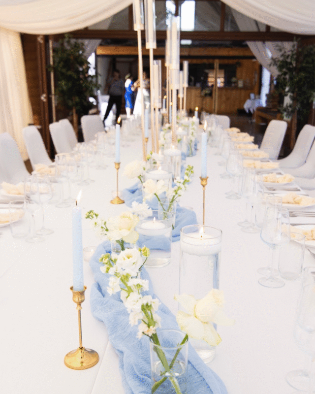 Wedding Table Set Up Blooming Roza. Blue runner and white flowers