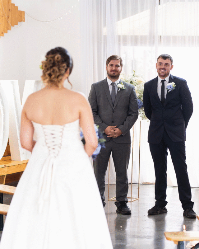 Cloud 9 shoot at Hoad Farm Barn. The groom and best man react to the Bride walking down the aisle.