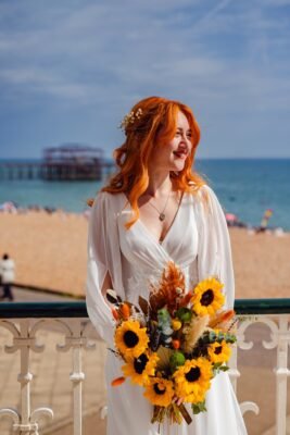 Decorative image. Bride with bouquet designed by Maisie from Blooming Roza. Taken in Brighton by the band stand.